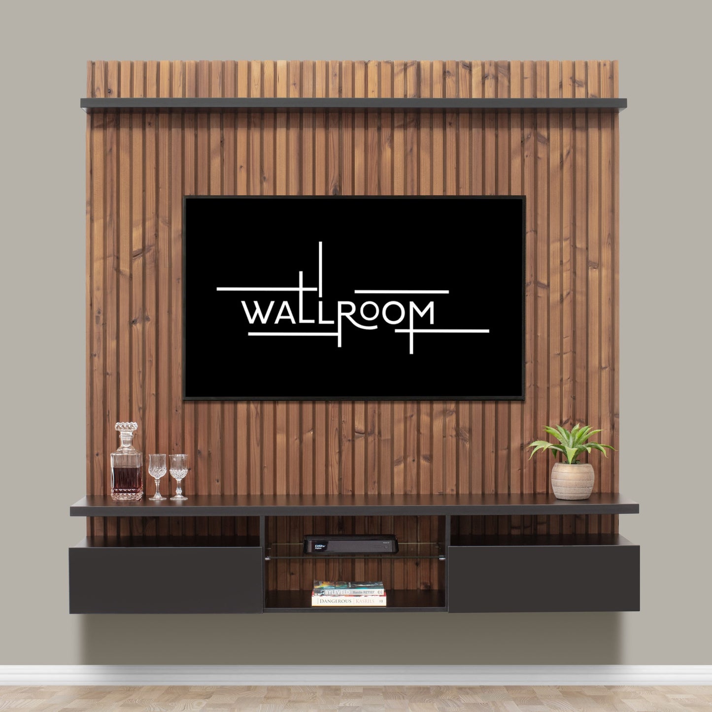 Modern living room wall featuring a sleek flat-screen tv surrounded by wooden paneling, with a floating TV stand below holding decorative items and books.