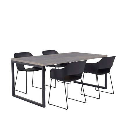 A modern dining table set for 4 with a dark wooden table, four black chairs with sleek frames (side view)