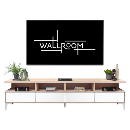 A sleek, modern living room setup featuring a mounted flat-screen tv on a simple, elegant white tv stand with decor accessories including a plant, books, and a sculpt