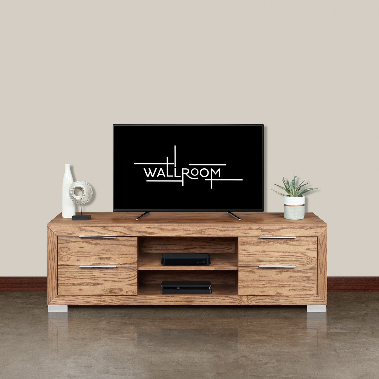 A modern minimalist living room featuring a flat-screen tv on a modern tv stand, flanked by a white decorative vase and a potted plant, against a plain background