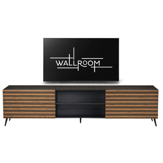 Sleek modern entertainment center with a minimalist design, featuring a flat-screen tv mounted above a long, two-toned media console with slatted wood doors and a central black compartment.