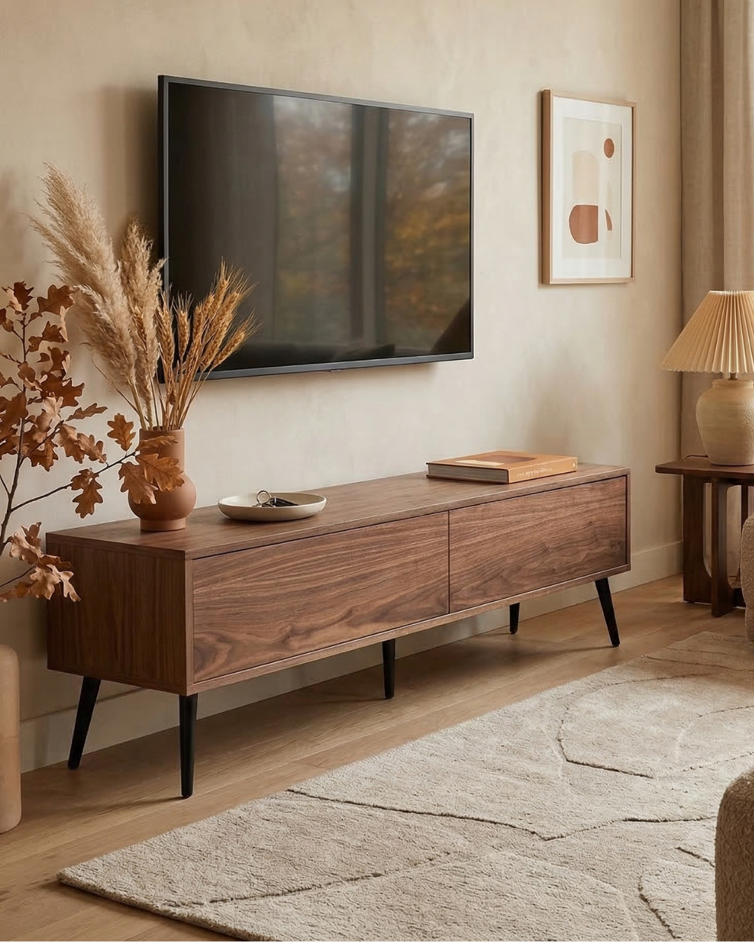 Wooden TV stand with decorative items in a living room setting